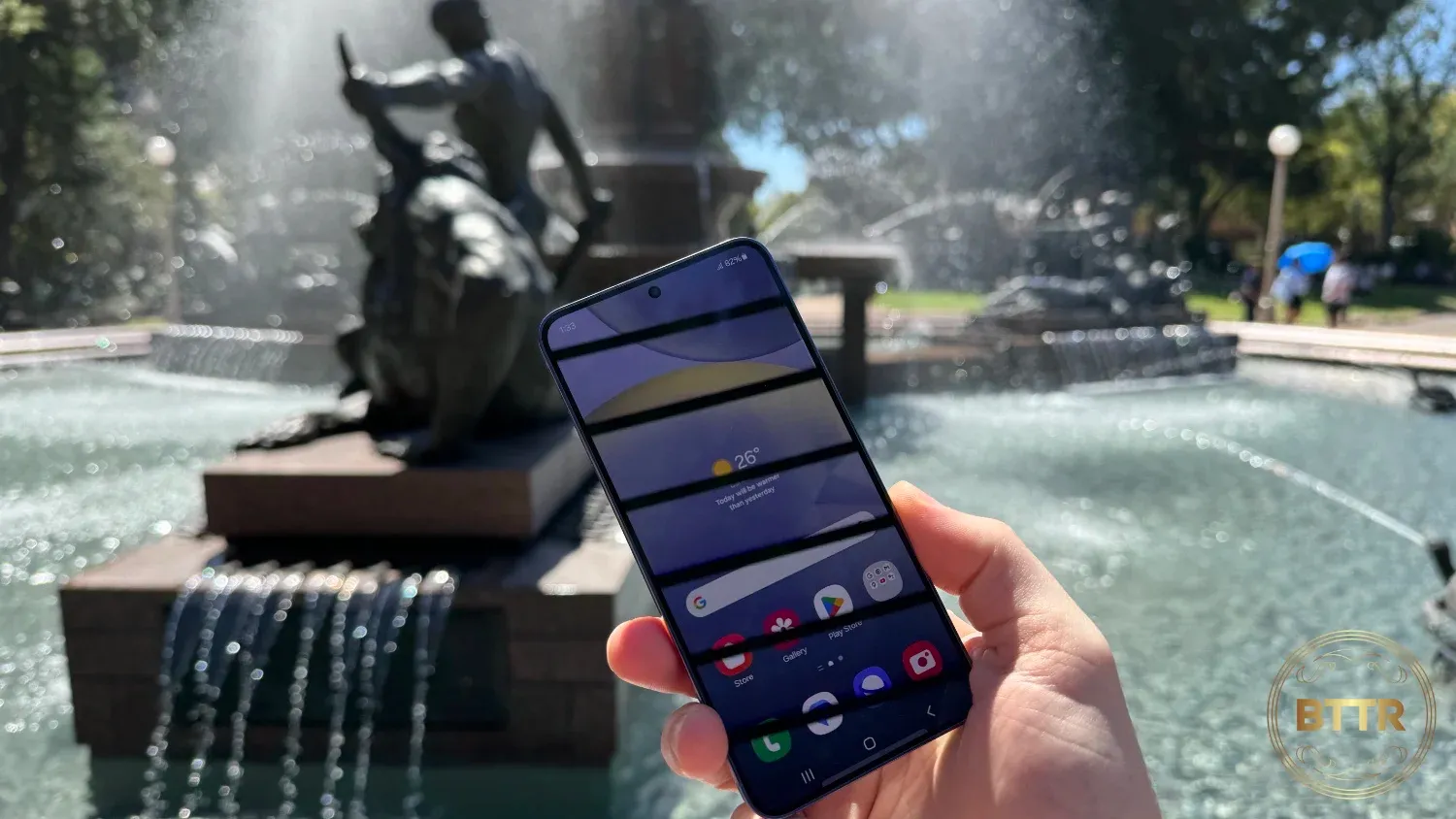 Samsung Galaxy S24 in front of a fountain