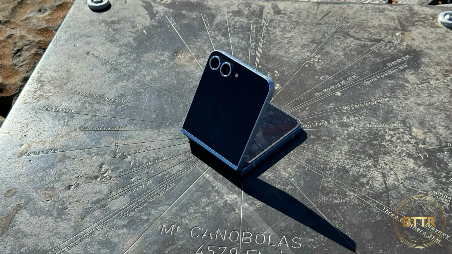 The Z Flip6 folded on a plaque at the top of Mt Canabolas