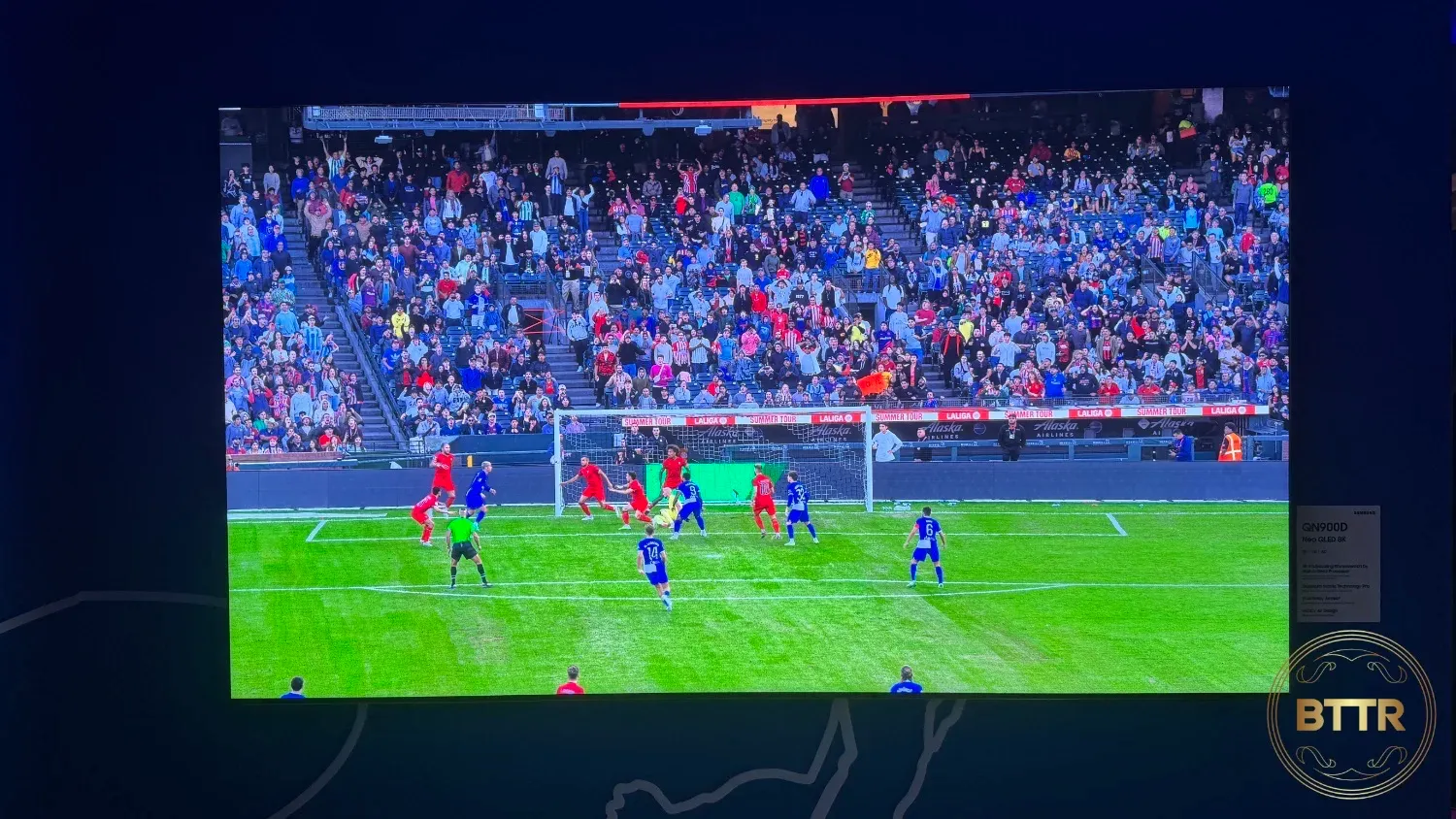 A Samsung 4K TV using AI to smooth a football's motion