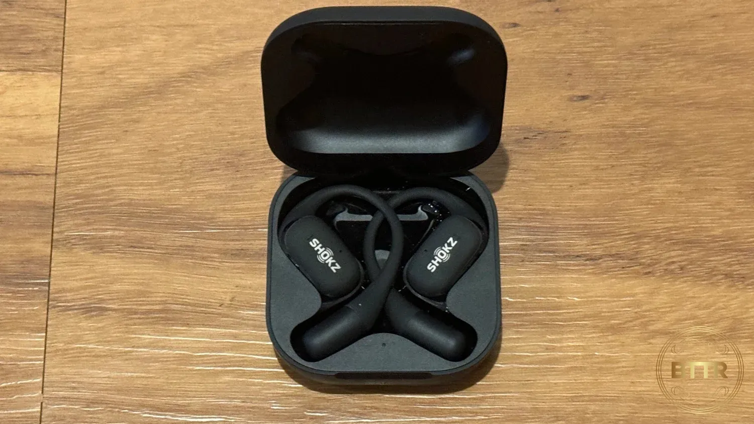 The Shokz Openfit in the case, with the case open