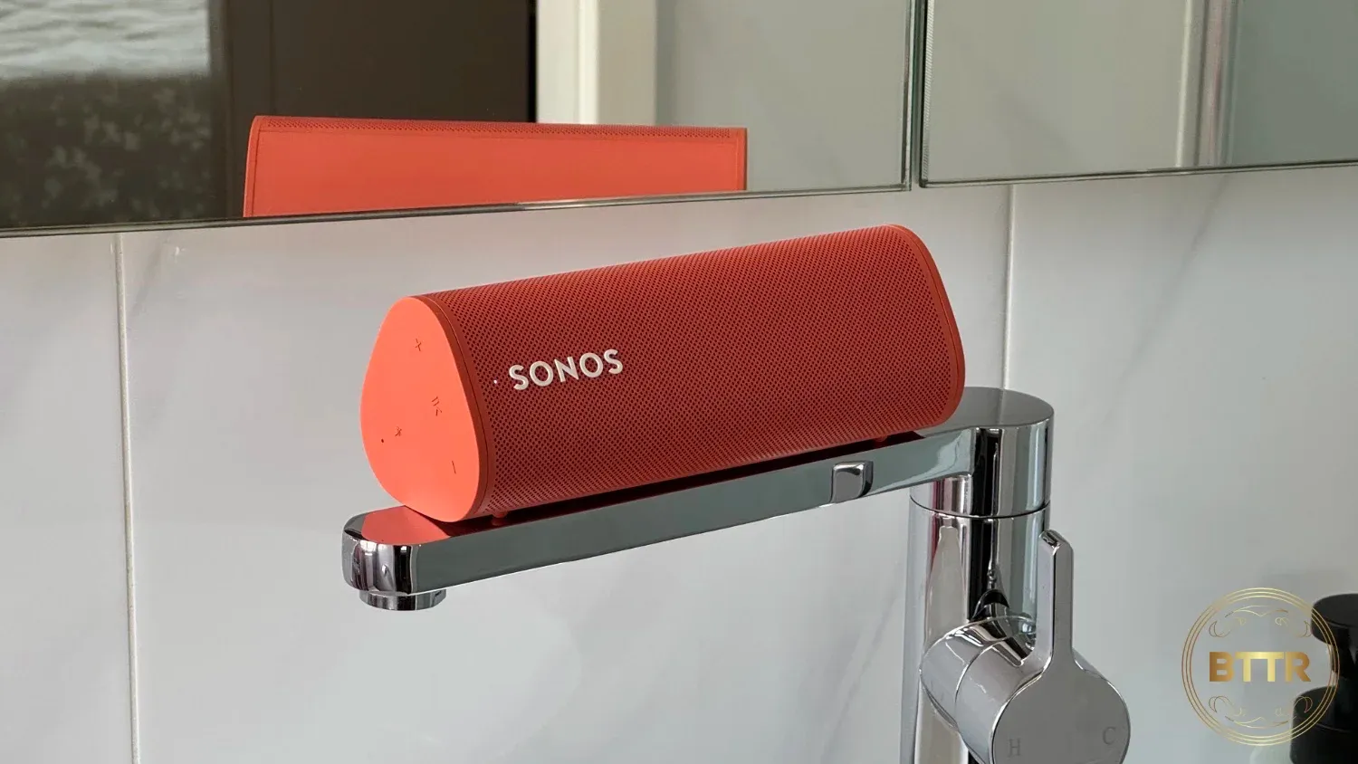 Sonos Roam resting on a tap