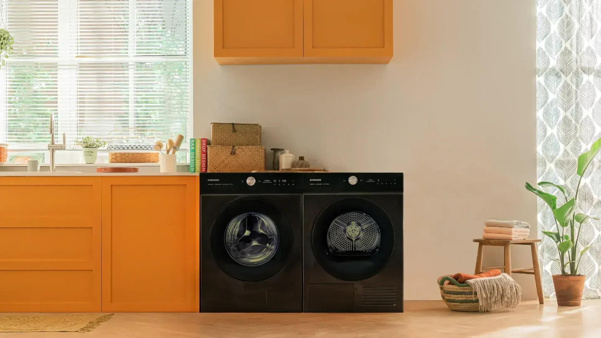 The Bespoke AI washer and dryer side by side in an orange laundry