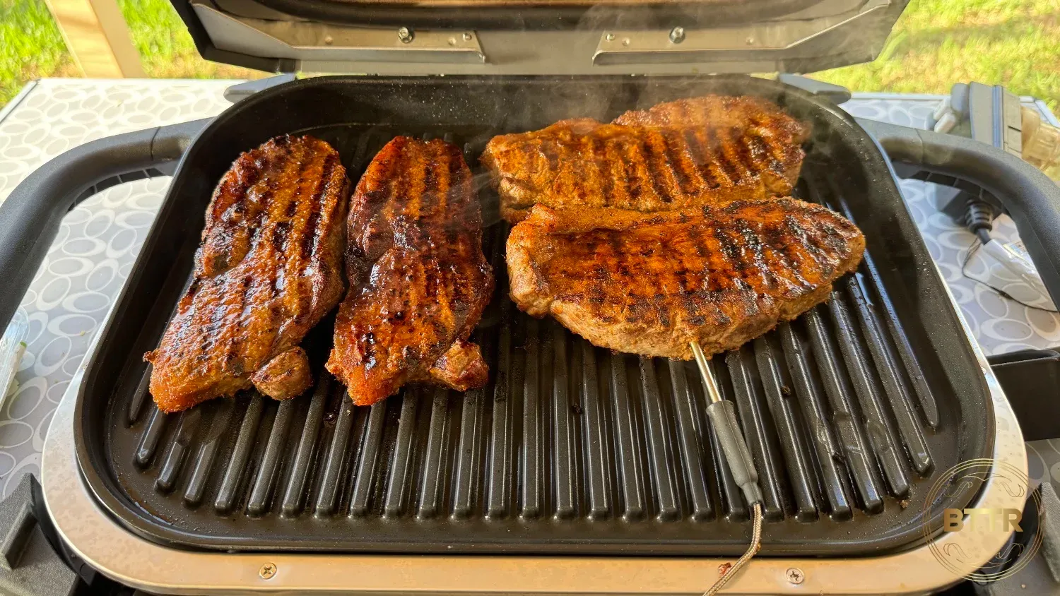 Cooking steaks on the grill