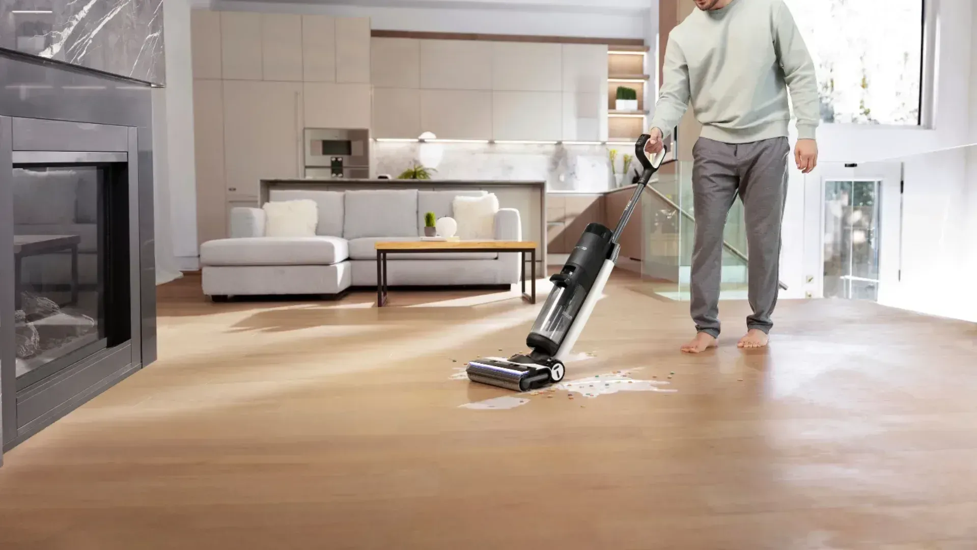 Man using the Tineco Floor One S7 Pro to clean up spilt milk