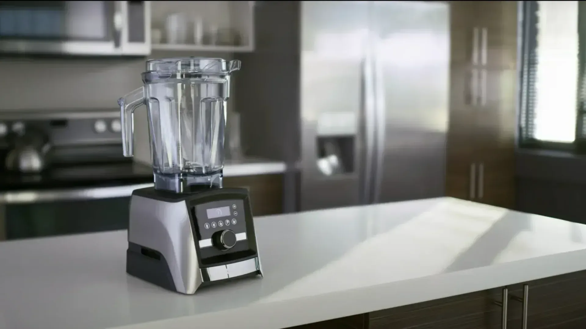 A blender standing on a clear benchtop