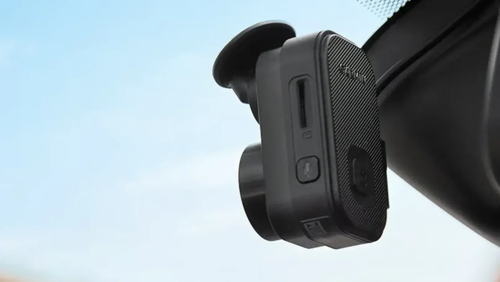 A dashcam installed in a car window