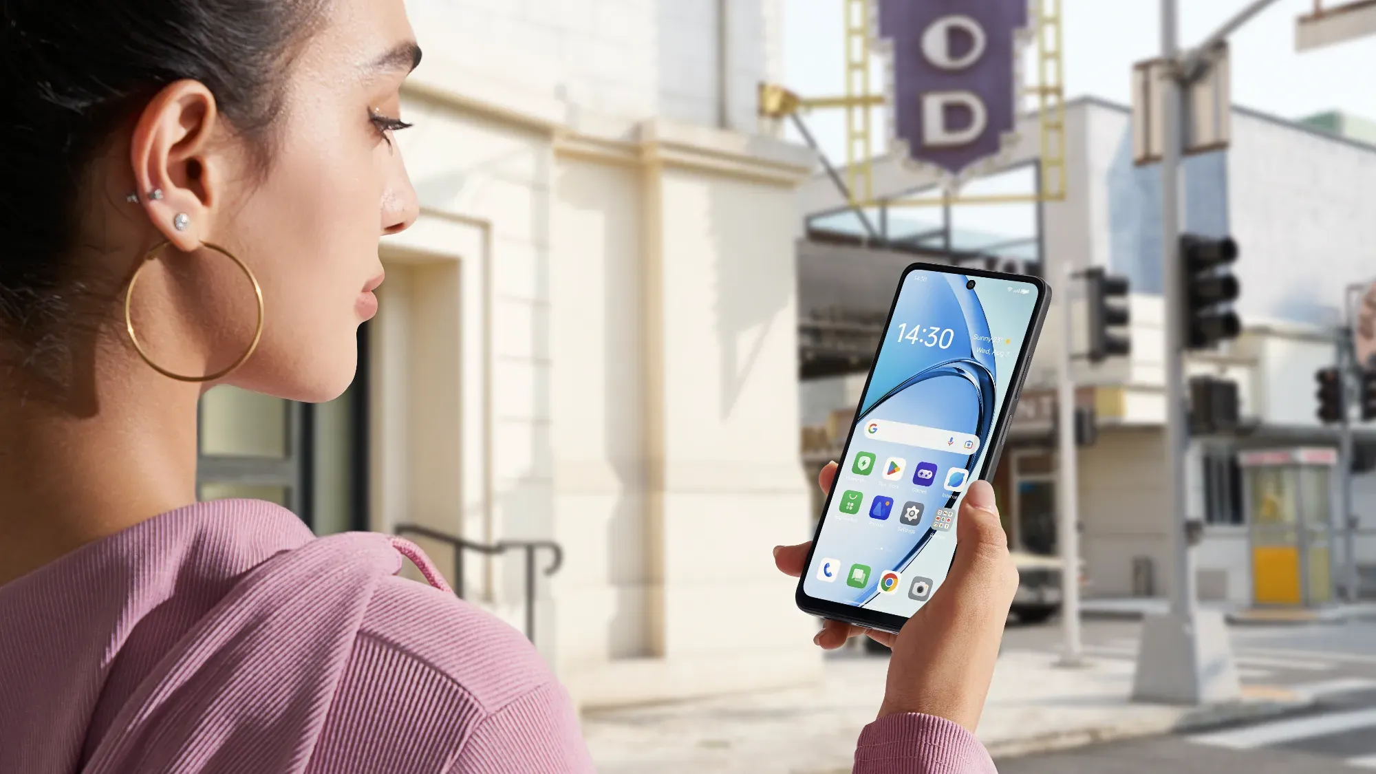 A woman looking at the OPPO A40's display