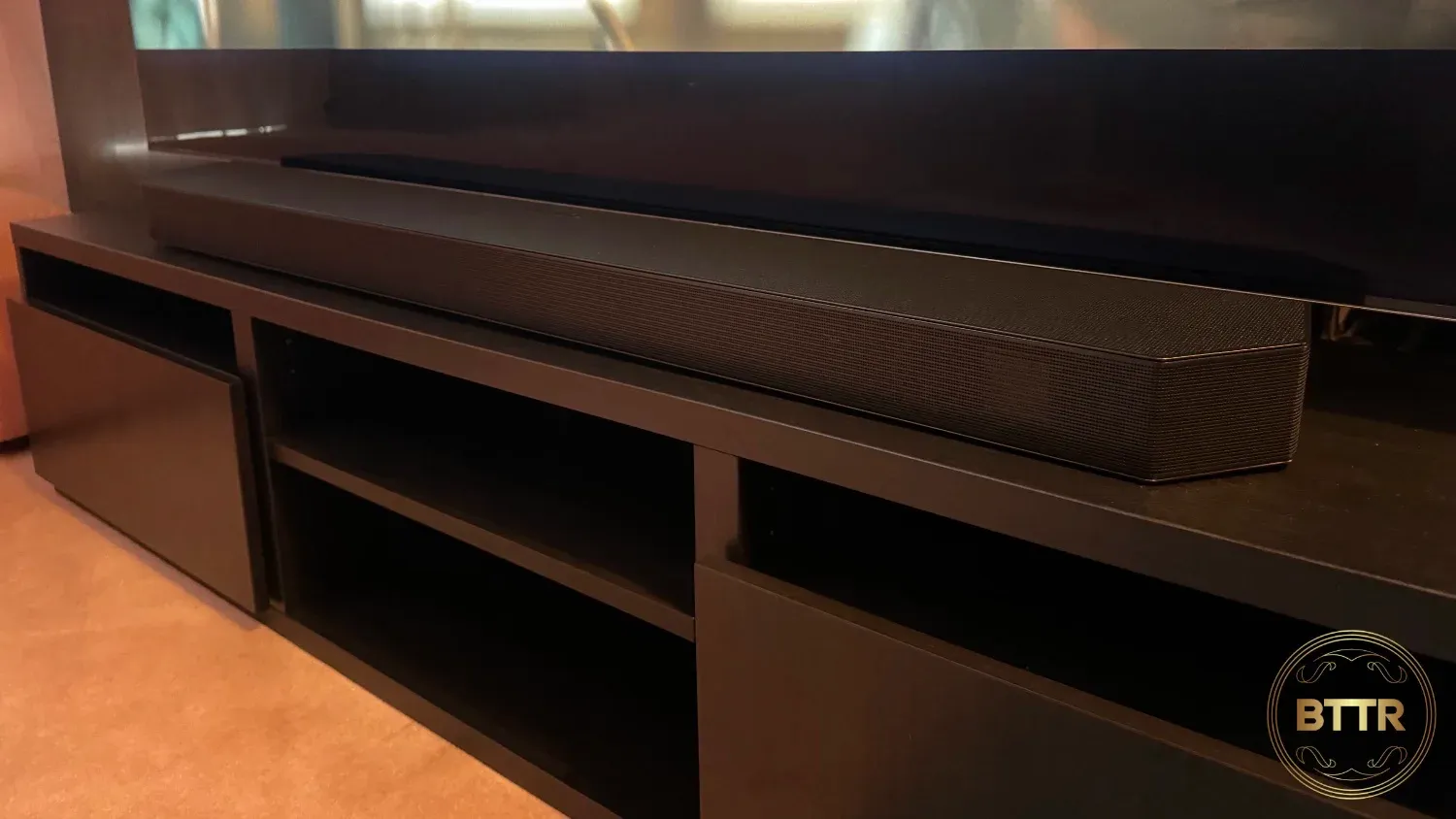 Looking at the Samsung HW-Q990D soundbar on an entertainment unit