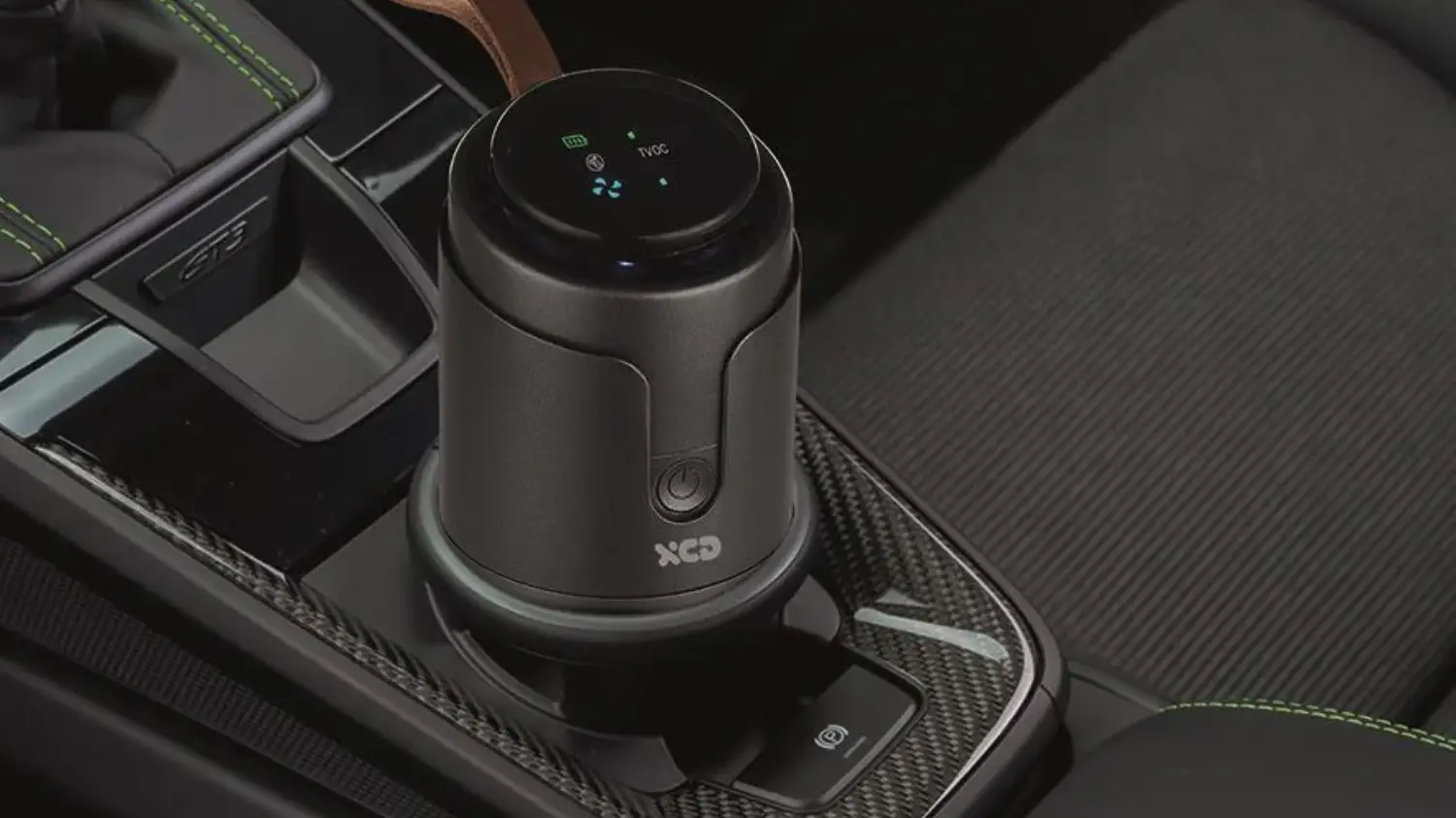 The XCD portable air purifier in a car cup holder