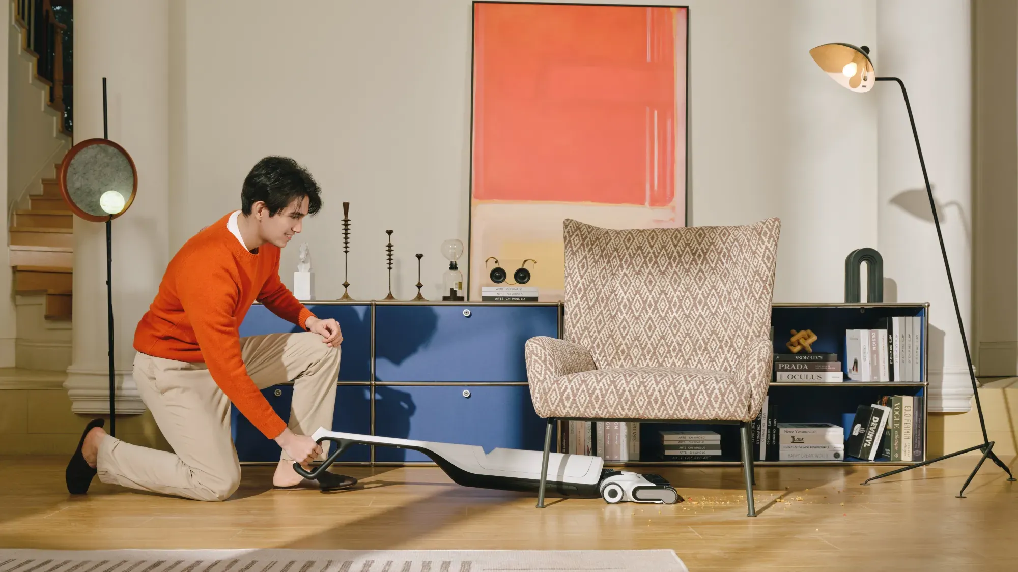 Man using Roborock flexi pro under a chair