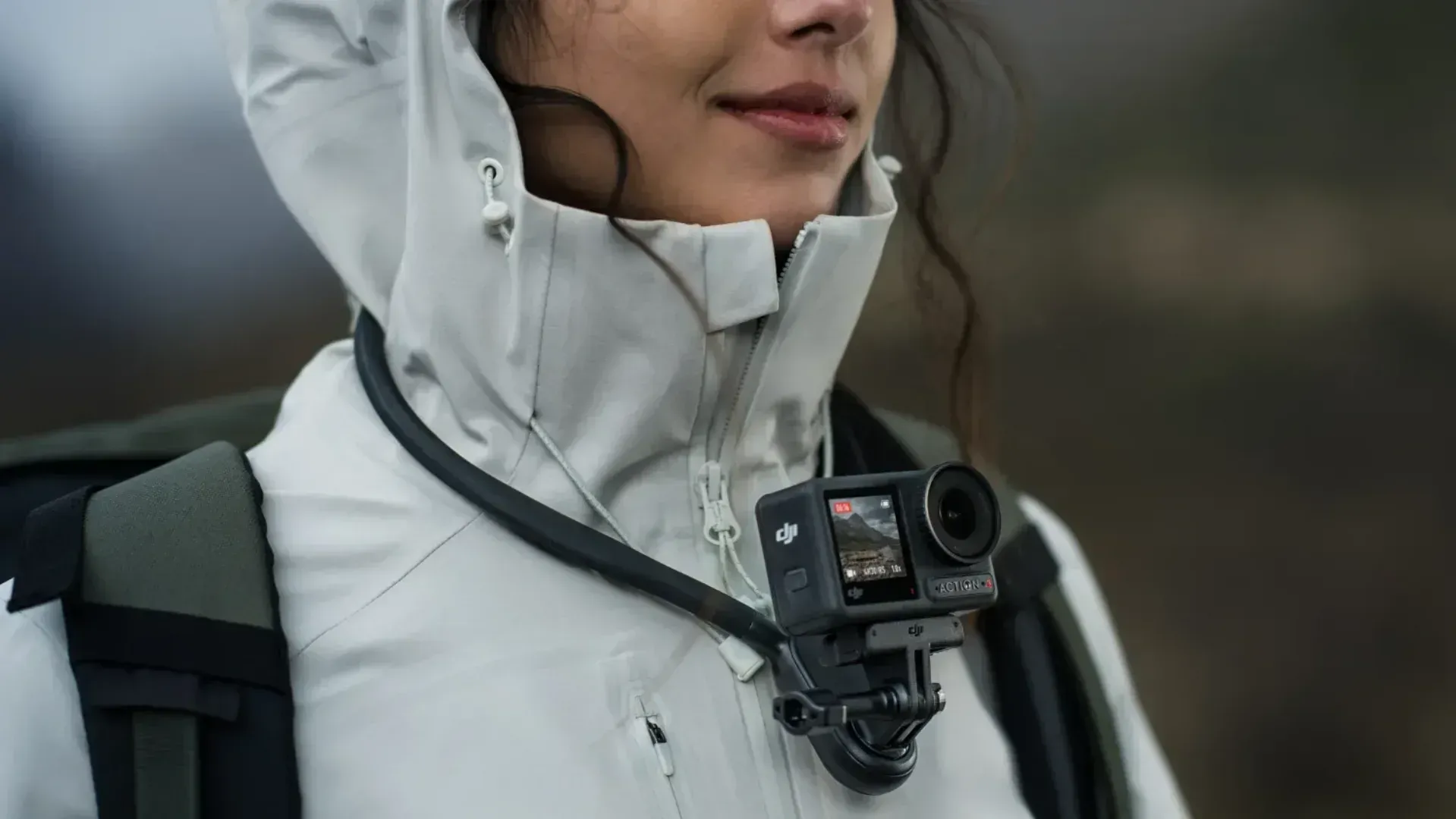 The DJI Osmo Action 4 on a neck strap