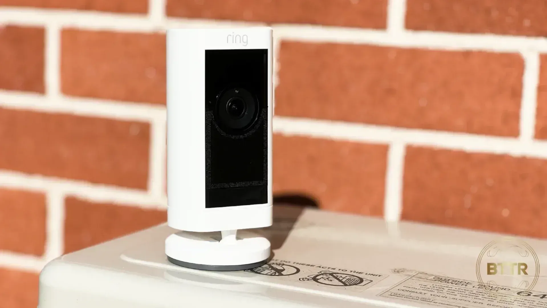 The Ring Stick up cam pro sitting on top of an outdoor air conditioner unit