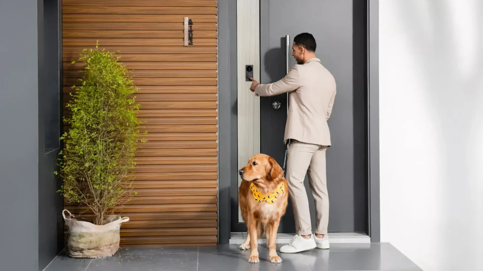 Man with a dog pressing an Aqara doorbell