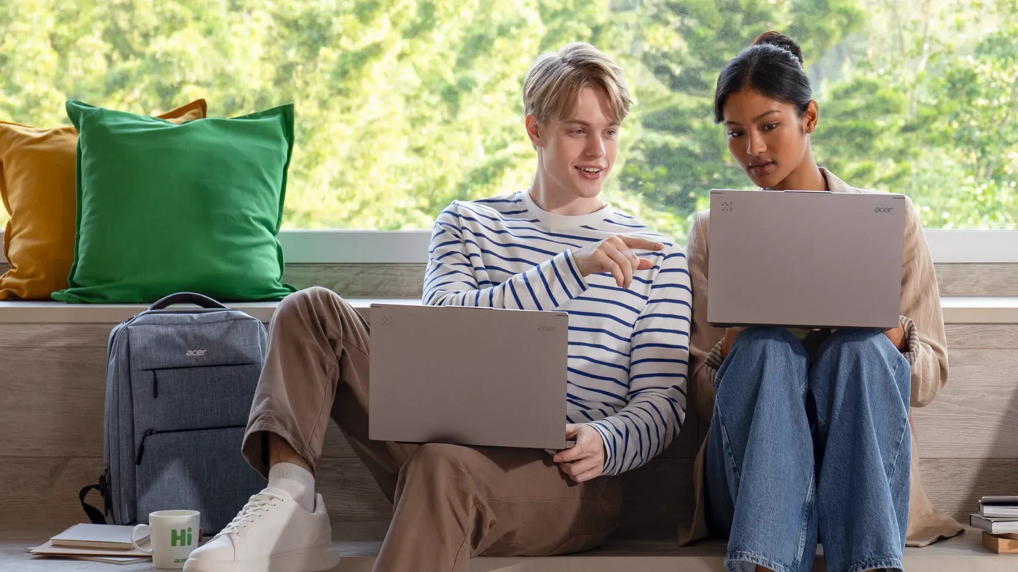 A couple of young people using Acer's new laptops