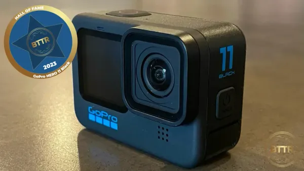 The GoPro HERO 11 Black camera on a table, with the BTTR Hall of Fame badge overlaid