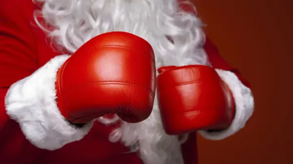 Santa wearing a pair of boxing gloves