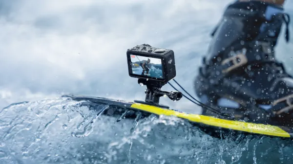 The Osmo Action 5 Pro attached to a wakeboard