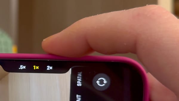 a closer look at the iPhone 16 screen while pressing the new shutter button