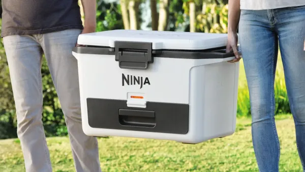 Two people carrying the Ninja FrostVault