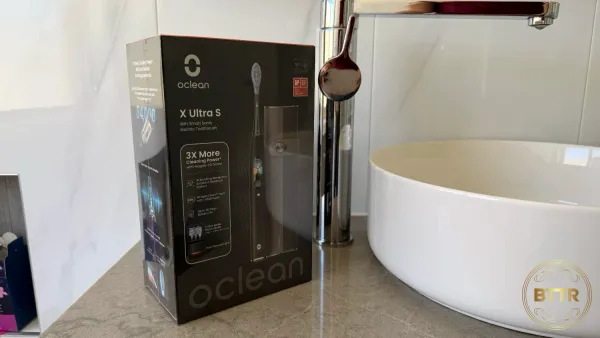 The Oclean electric toothbrush prize on a bathroom sink.