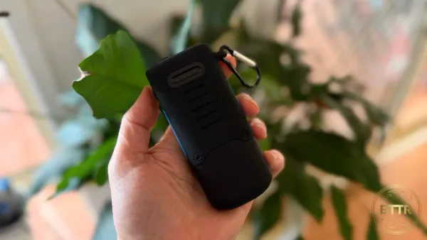 Holding the NRGVault power bank by a plant