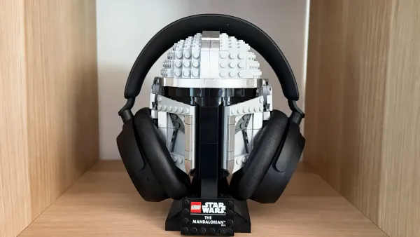 The Sennheiser ACCENTUM Plus Wireless headphones on a Lego Mandalorian helmet