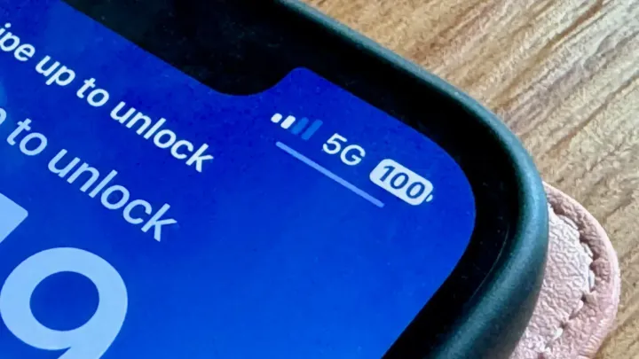 Zoomed in view of a phone with a 5G signal