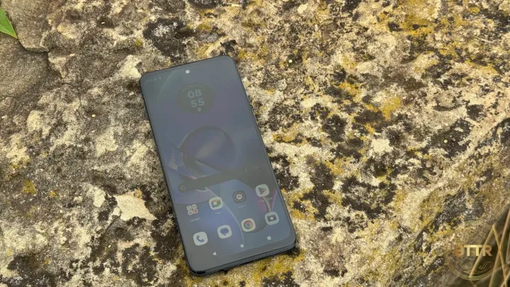 The Motorola Moto G54 5G sitting on a rock