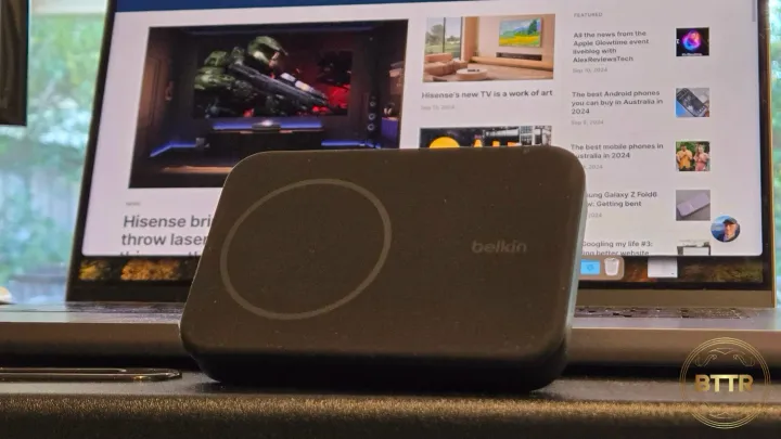 The Belkin BoostCharge Pro in front of a Macbook pro